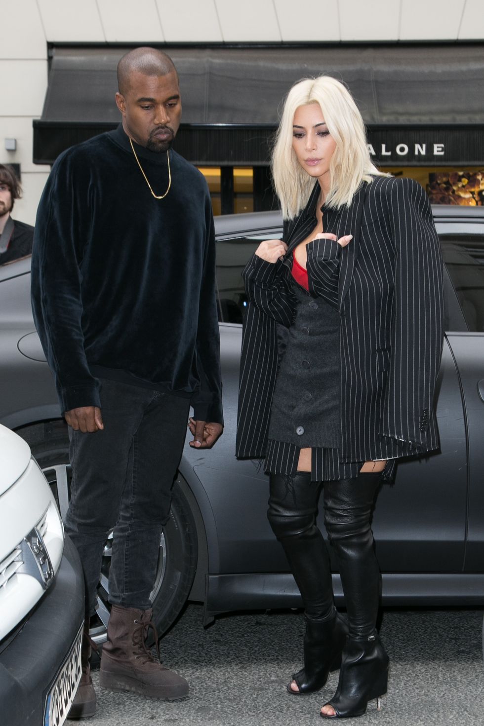 Kim Kardashian wears a pinstripe suit in Paris