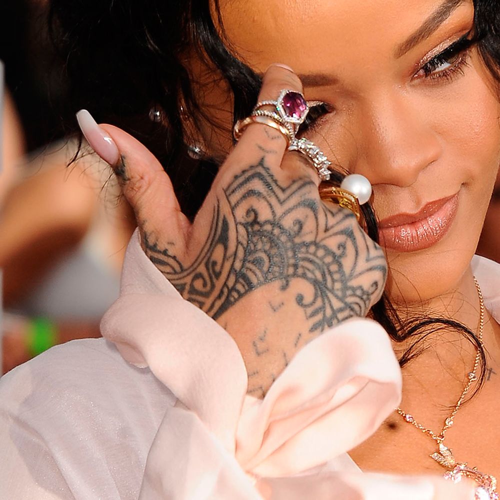 Rihanna, Kaley Cuoco, and More Celebrities Who Have Had Their Tattoos  Covered Up After a Breakup - Life & Style