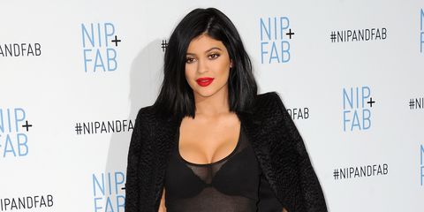 Kylie Jenner in black plunging outfit at Nip+Fab photocall