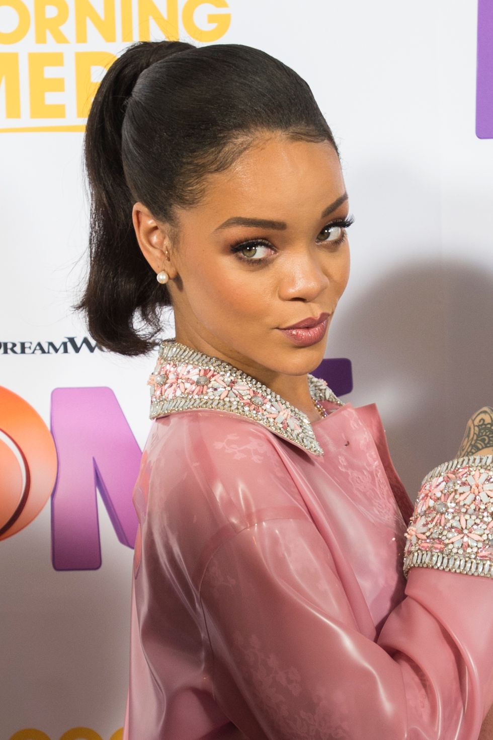 Rihanna wears a pretty pink raincoat for Home screening