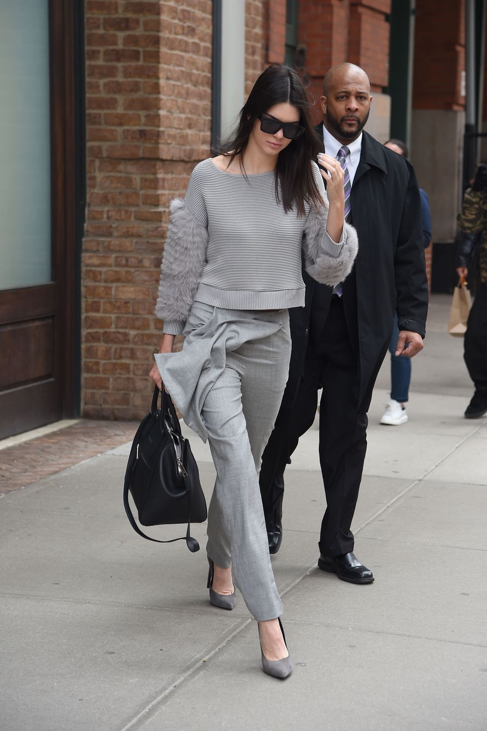 Kendall Jenner wearing grey jumper and trousers in New York