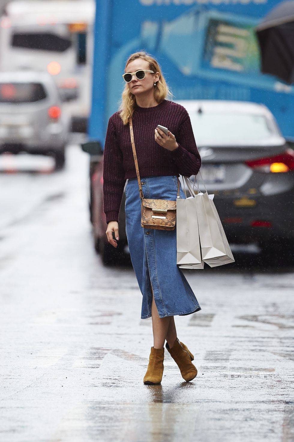Diane Kruger wears a denim skirt and chunky jumper in New York