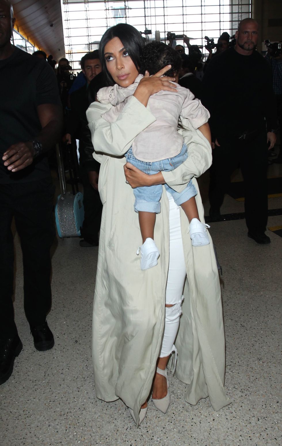 Kim Kardashian West and North West at an airport April 2015