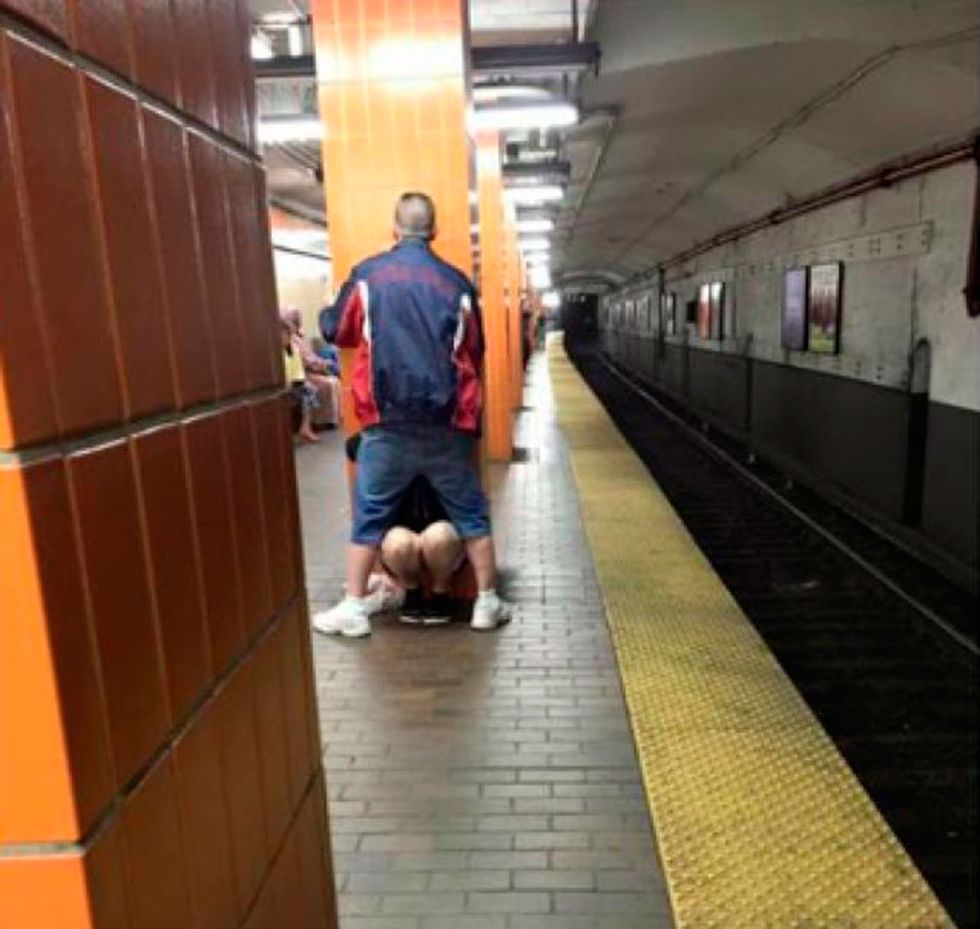 A couple have just been caught mid-blow-job on a subway platform
