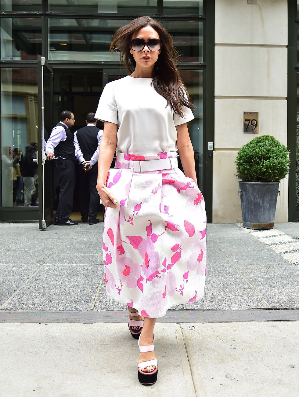 Victoria Beckham wearing a pink floral skirt