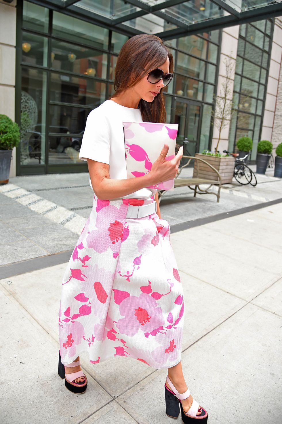 Victoria Beckham wearing a pink floral skirt in NYC