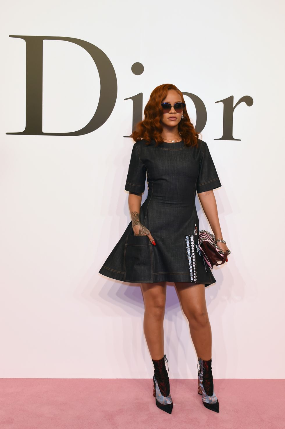 Rihanna wears a custom-made dress at the Dior AW15 show in Tokyo