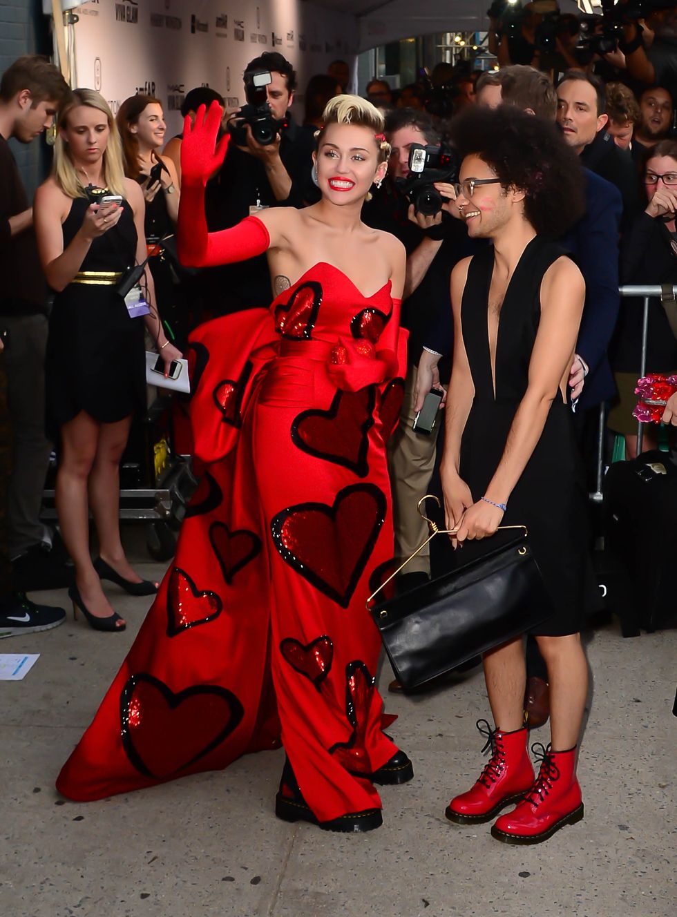 Miley Cyrus in a red heart dress at the 2015 amfAR Gala