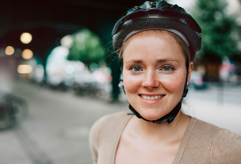 Woman wearing cycling helmet