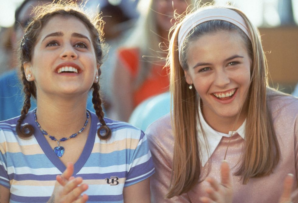 Cher Horowitz wearing a pink jumper and hairband, Clueless