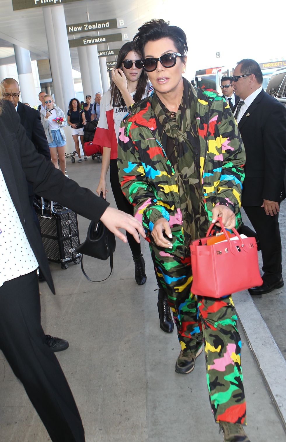 Kris Jenner wearing an all camouflage outfit at the airport