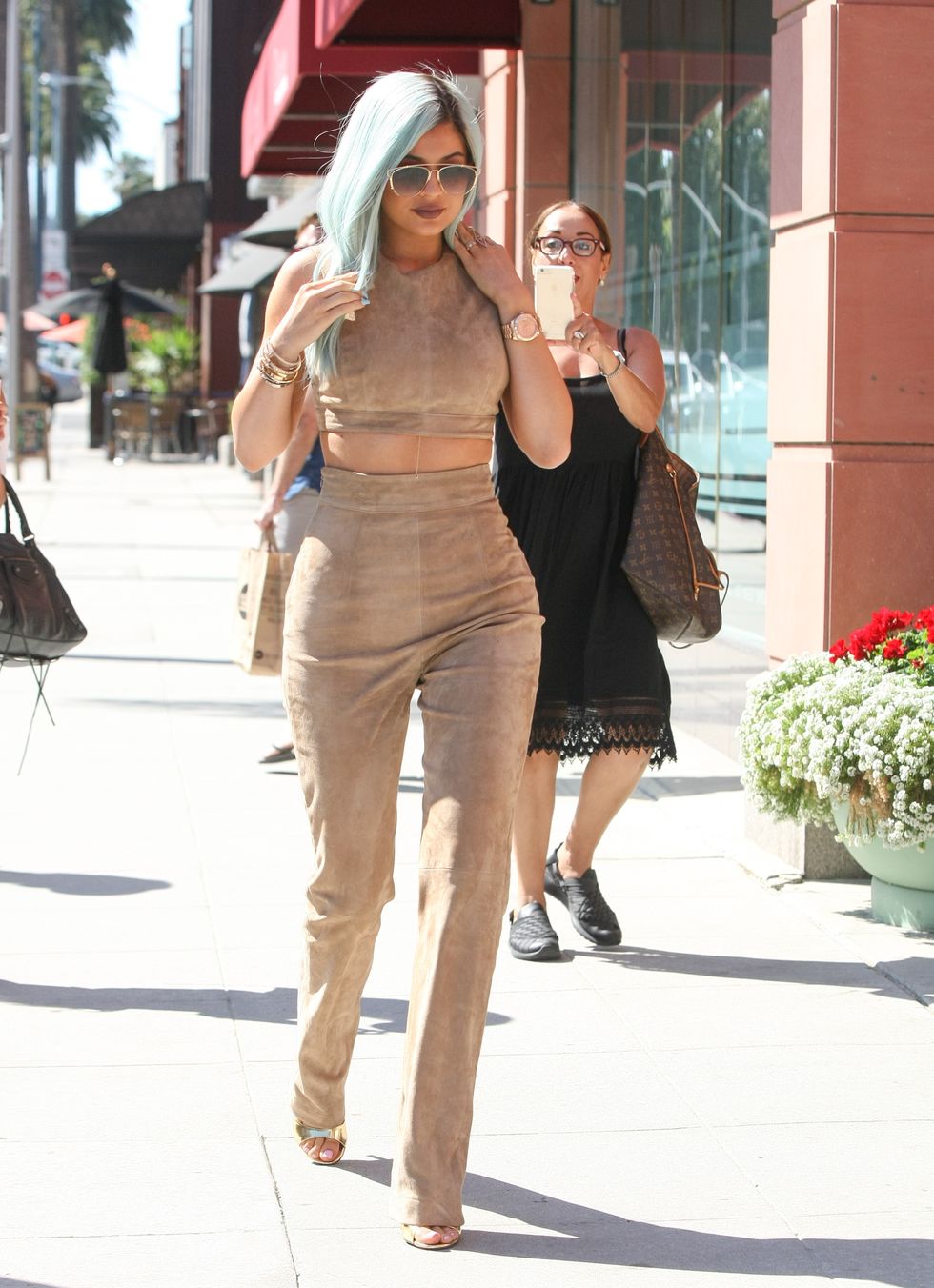 Kylie Jenner wears matching suede crop top and trousers while out in LA