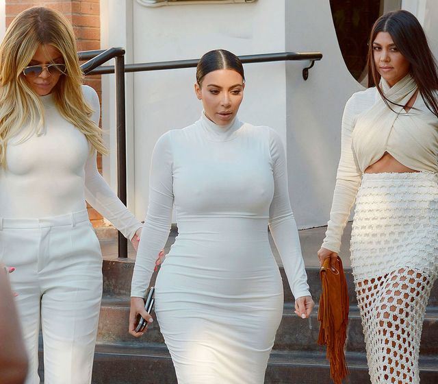 Khloe, Kim and Kourtney Kardashian wearing white outfits together