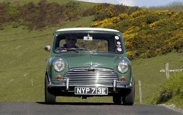 Vintage mini cooper driving through the countryside