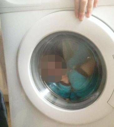 Woman posts Facebook photo of a toddler with Down's Syndrome trapped in a washing machine