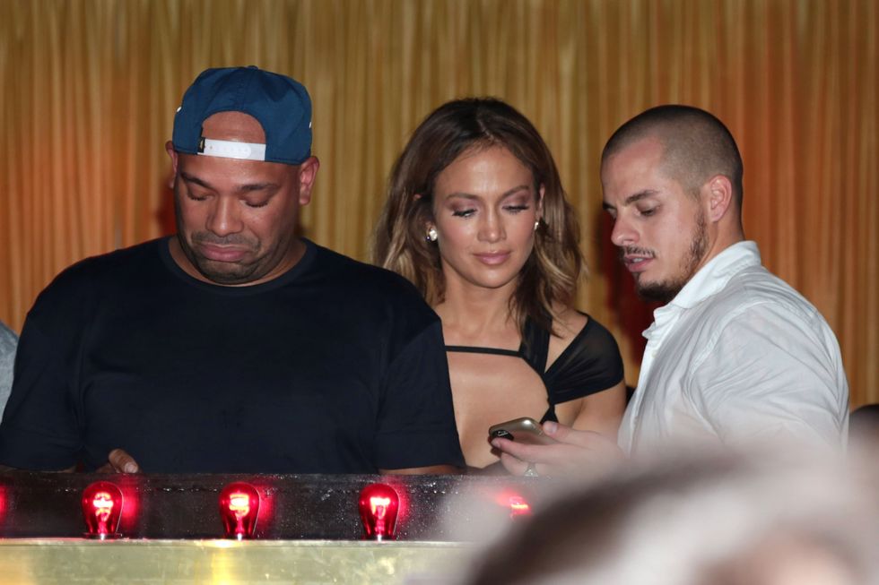 Jennifer Lopez snoops on her friend's phone at her birthday celebrations at 1OAK