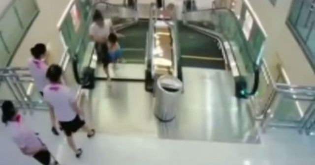 Woman killed by escalator