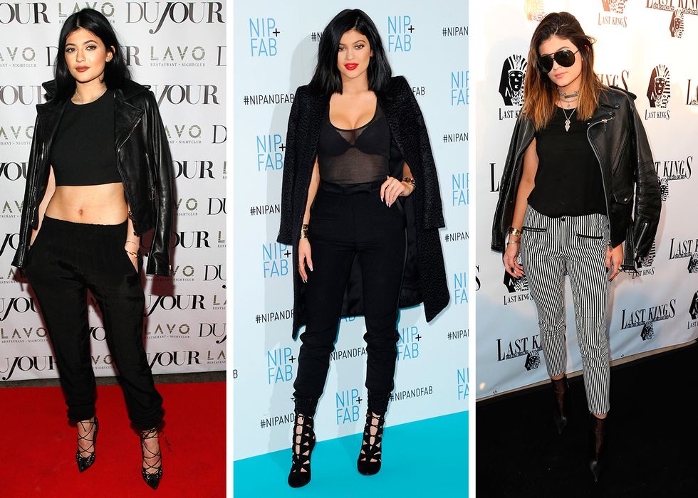 Kylie Jenner wearing trousers, black top and black shrobed jacket