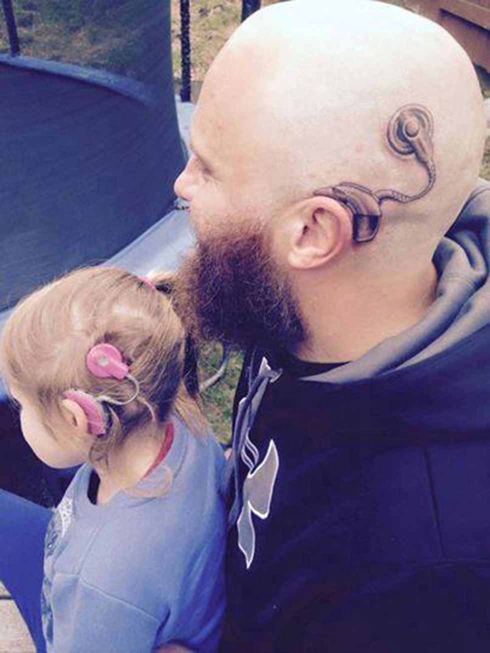 This dad did the sweetest thing to make his daughter with a hearing aid feel better