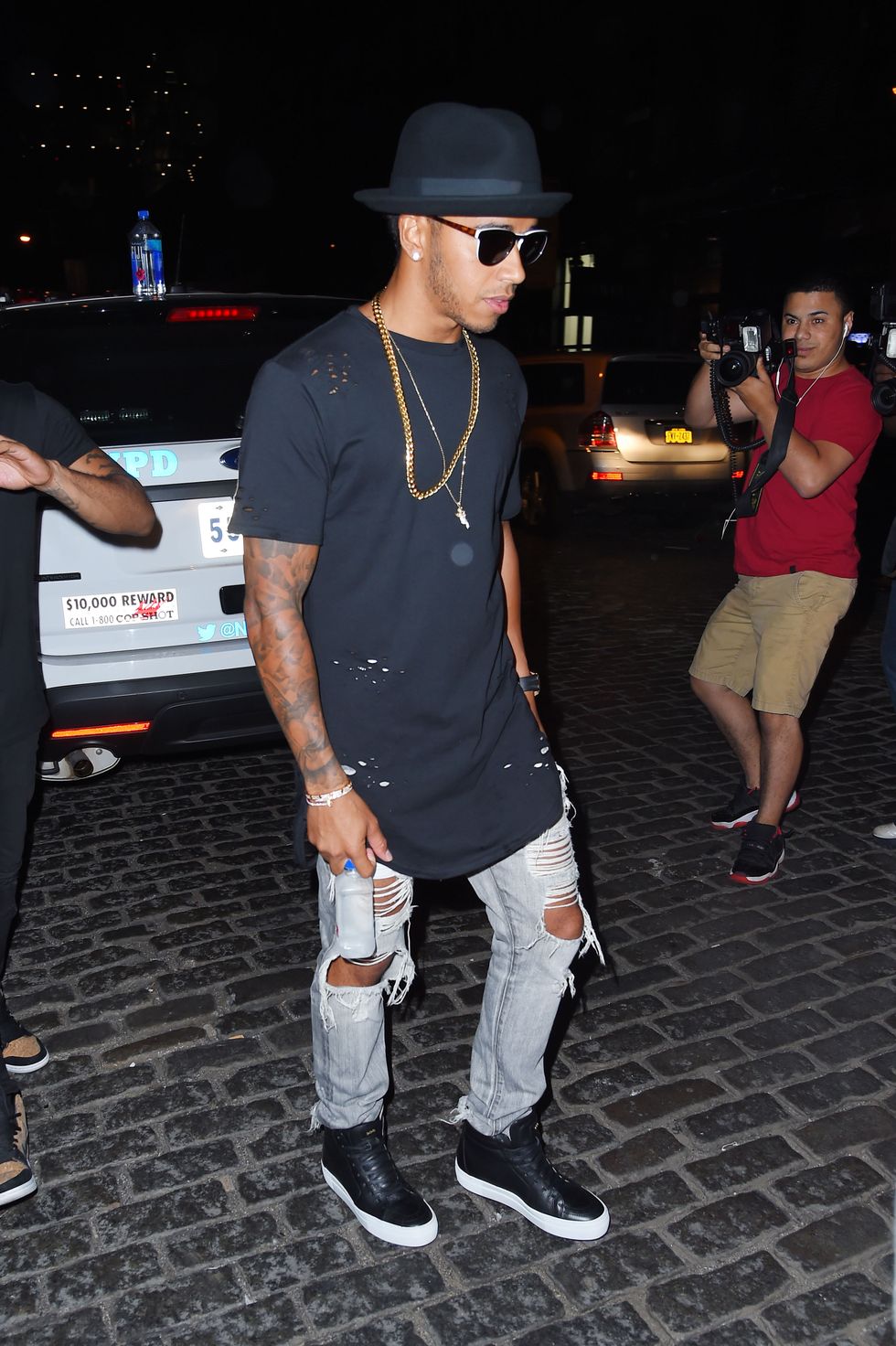 Lewis Hamilton went clubbing with Rihanna wearing ripped jeans, a black T-shirt, and a fancy hat