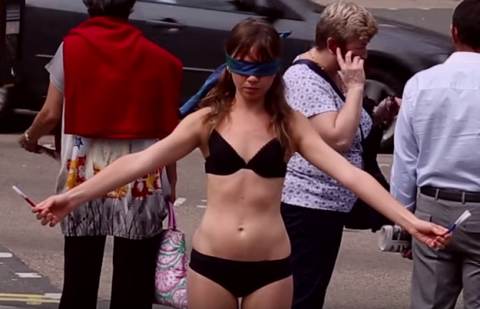 Jae West stands blindfolded in her underwear in Piccadilly Circus to promote body acceptance