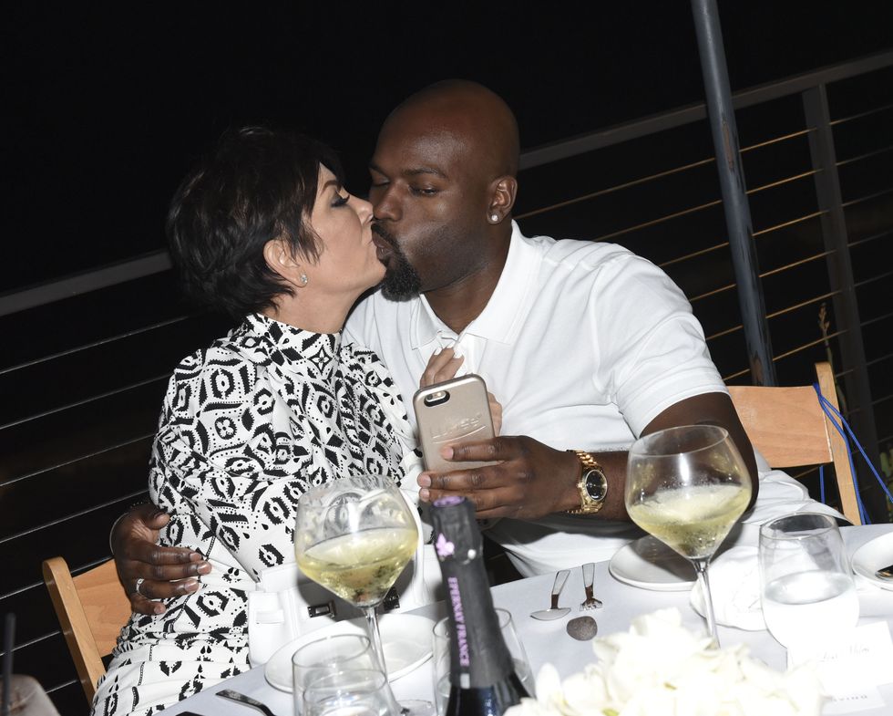 Kris Jenner and Corey Gamble making out hard at the Haute Living cover party
