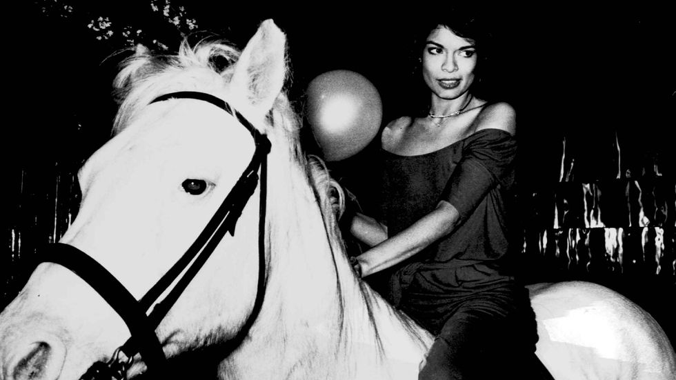 Bianca Jagger at Studio 54 in the '70s riding a white horse