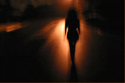 Woman walking at night