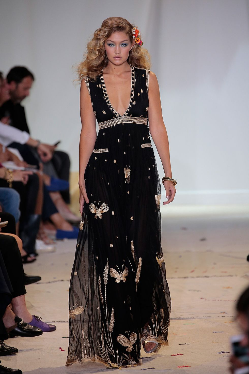 Gigi Hadid wearing a butterfly embroidered maxi dress
