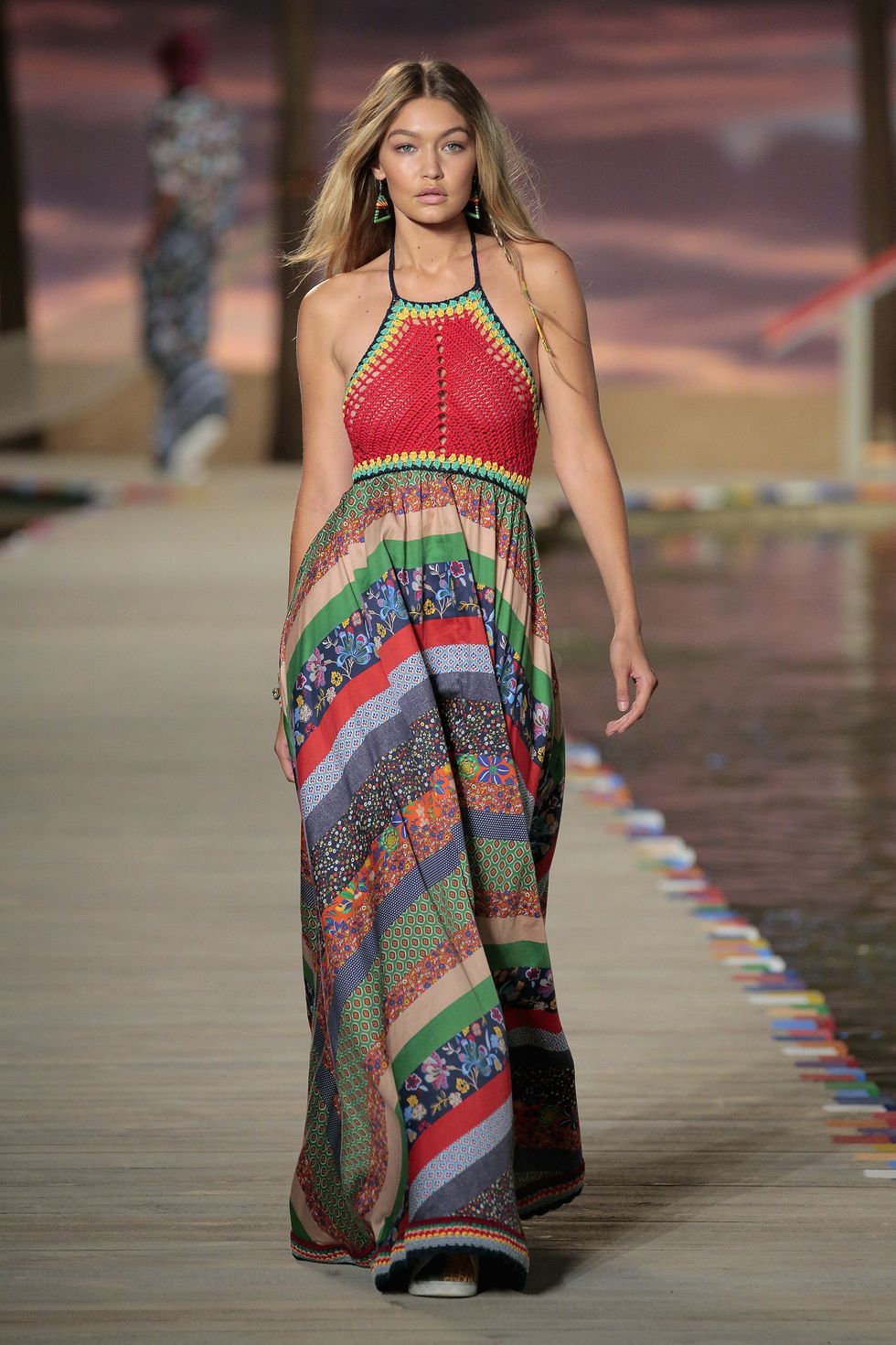 Gigi Hadid wearing a crochet maxi dress at Tommy Hilfiger