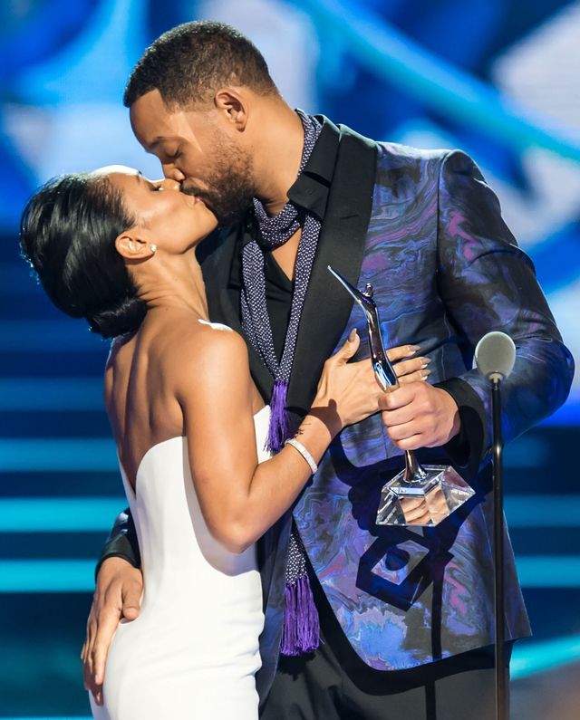Will Smith and Jada Pinkett Smith kissing onstage at the BET awards