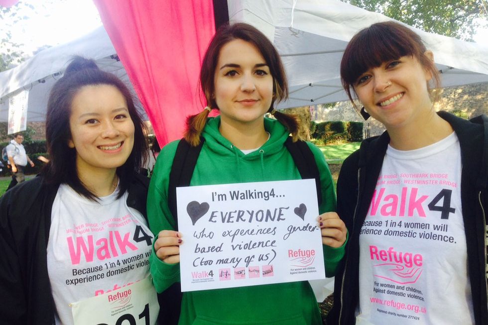 Women holding a 'walking for' sign