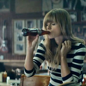 Taylor Swift with a diet coke