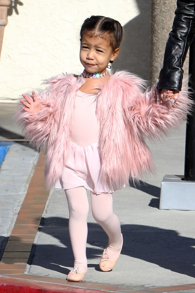 North West wearing a pink fluffy coat to ballet