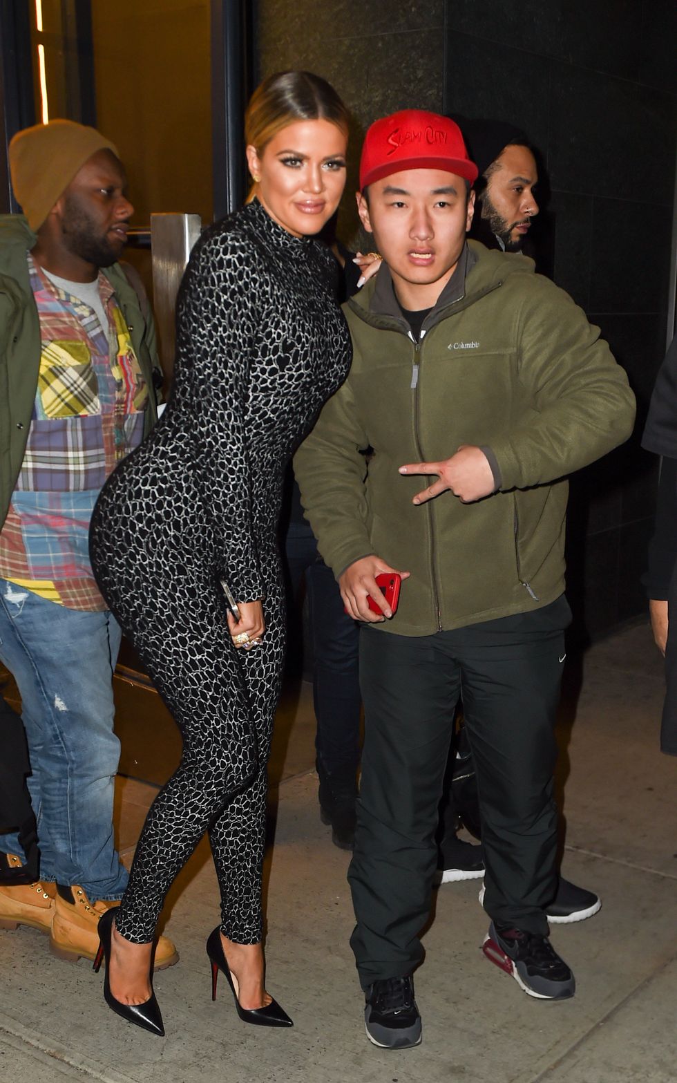 Khloe Kardashian meeting fans in a leopard catsuit