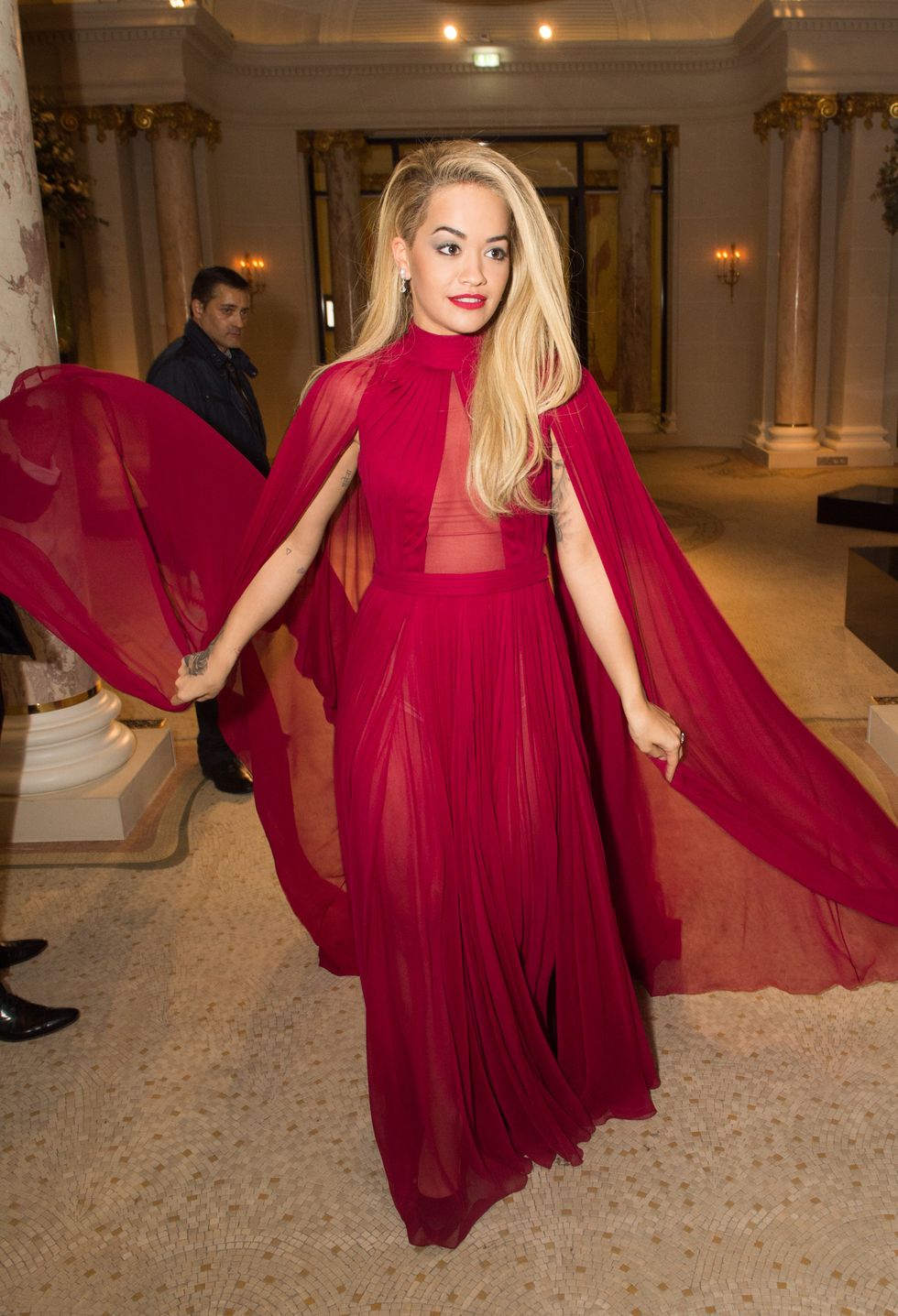 Rita Ora wearing a pink gown at Paris Fashion Week