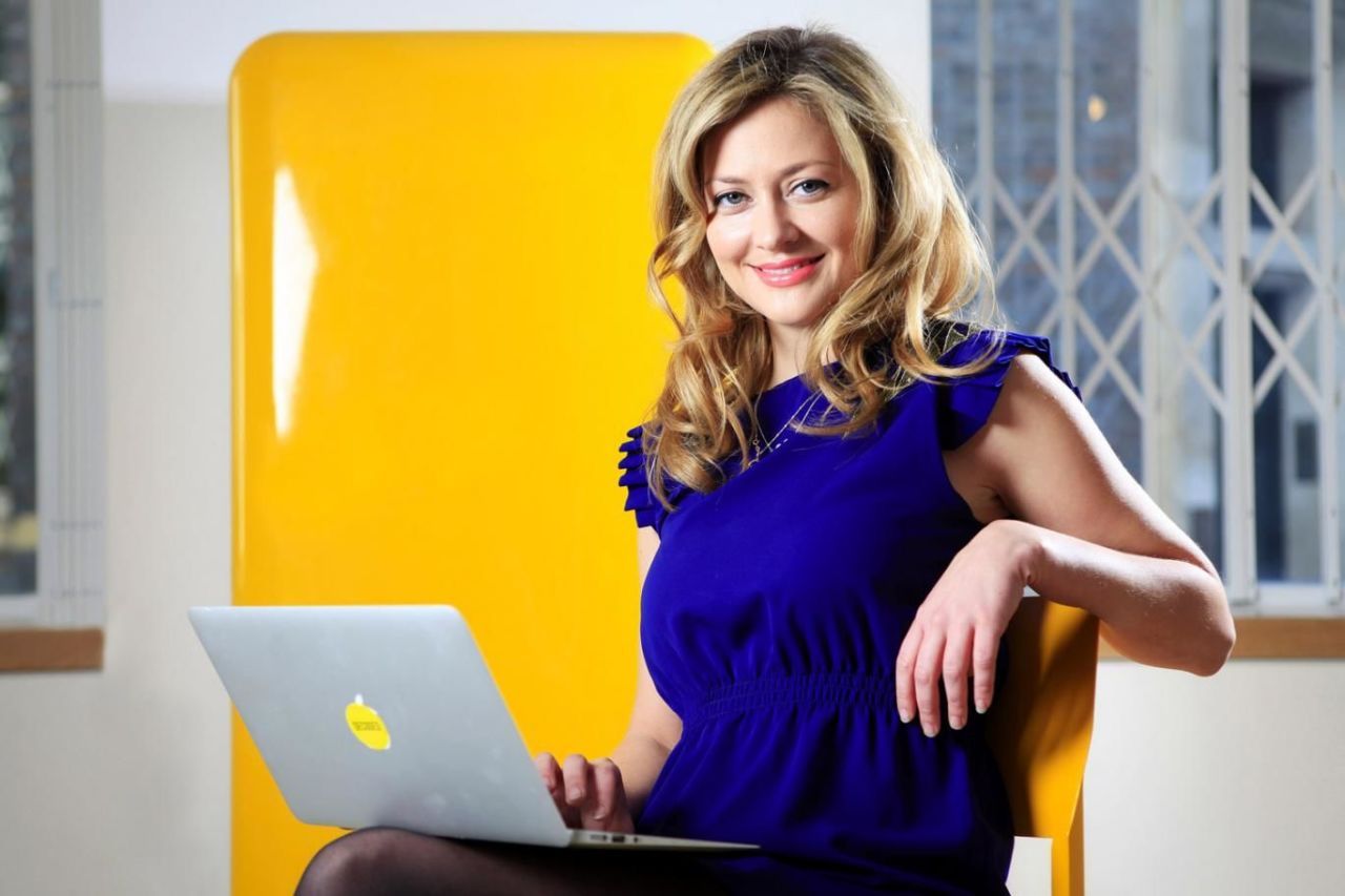 Product, Yellow, Dress, Shoulder, Laptop part, Electronic device, Sitting, Laptop, Day dress, Electric blue, 