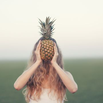 Woman with food pineapple