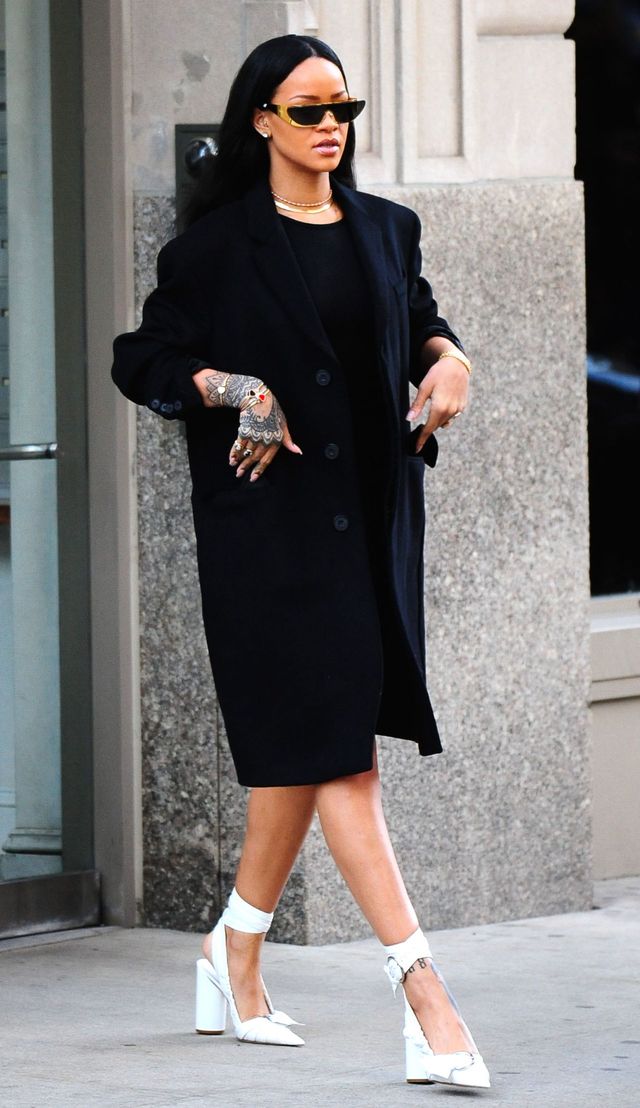 Rihanna out and about wearing black shift dress and heels
