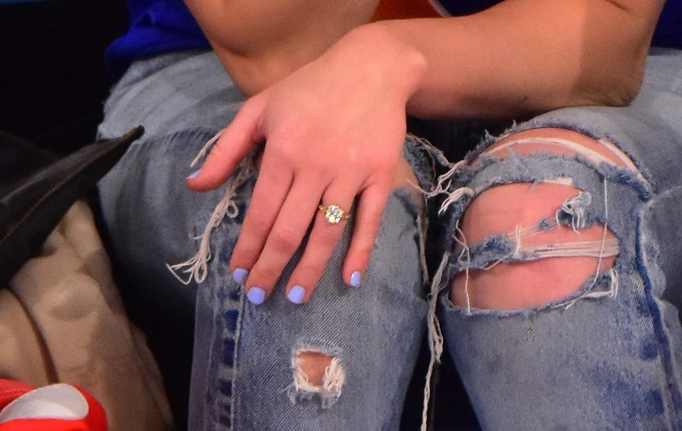 Miley Cyrus engagement ring at the Cavaliers Knicks basketball game