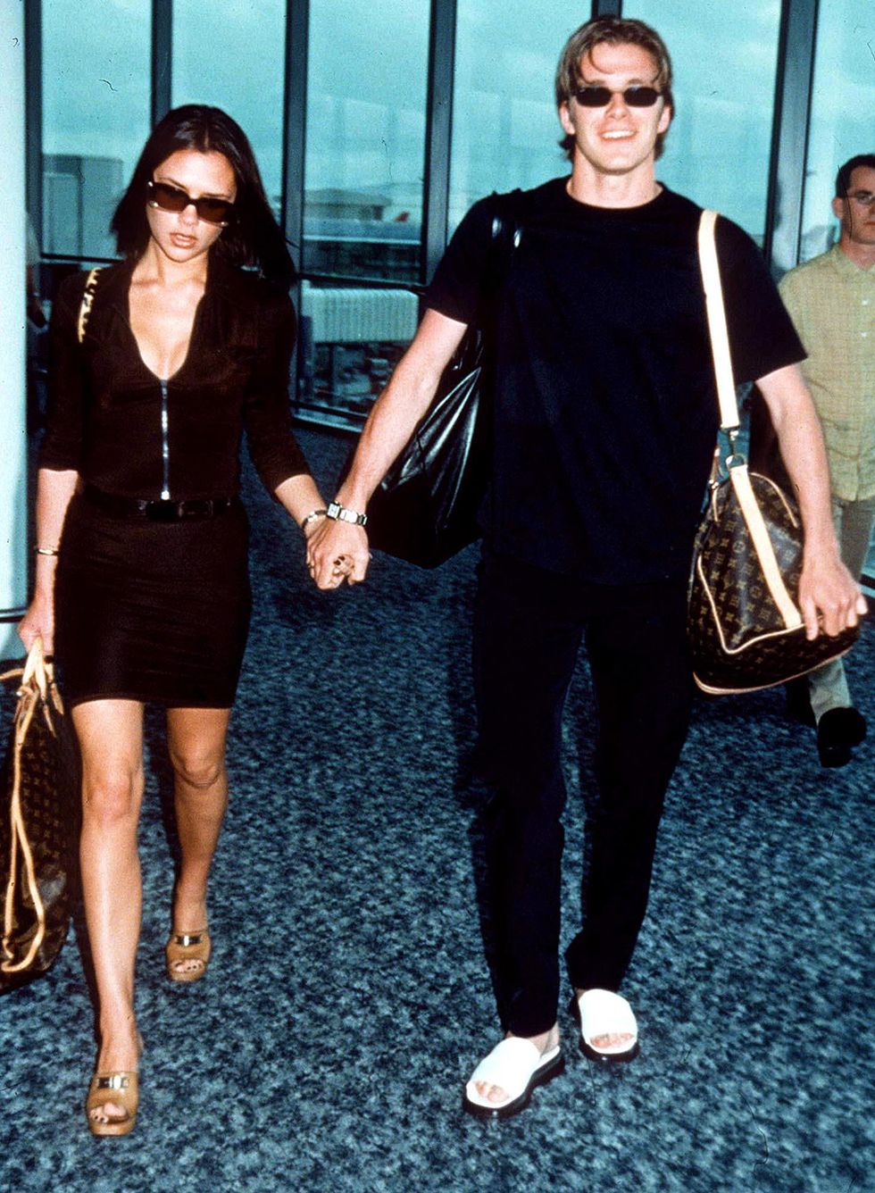 David and Victoria Beckham in 1997 wearing Louis Vuitton