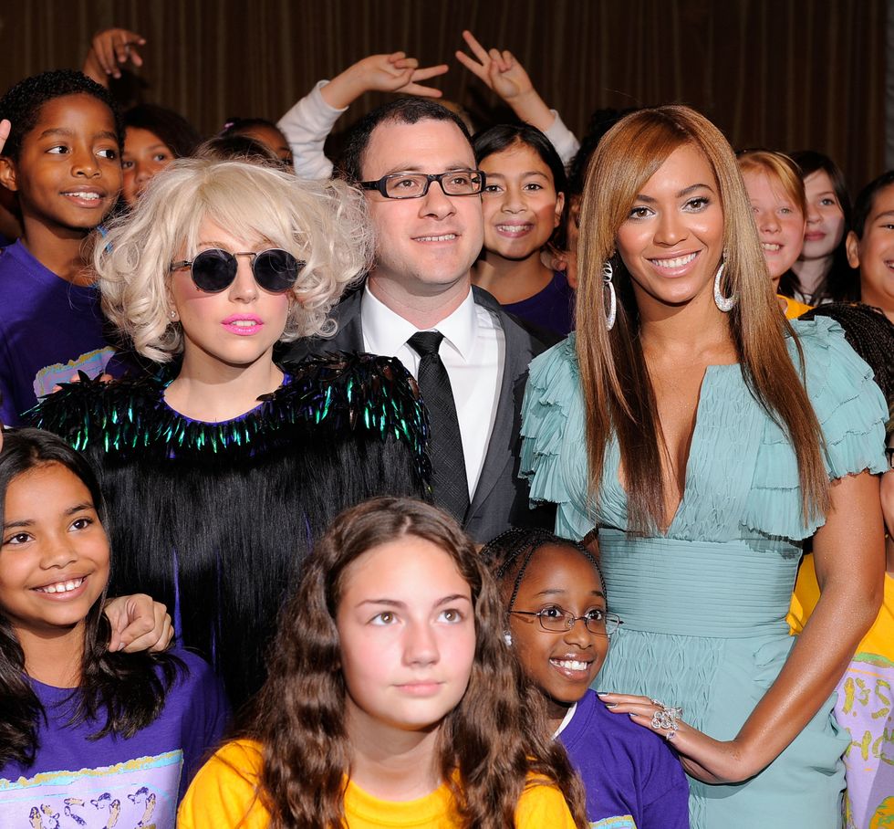 <p>Lady Gaga smiles beside Beyoncé and the children's chorus from P.S. 22 during Billboard's Women in Music event.</p>