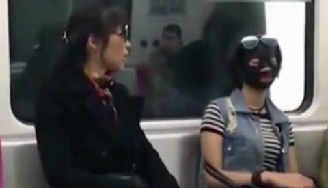 Woman commutes in face mask