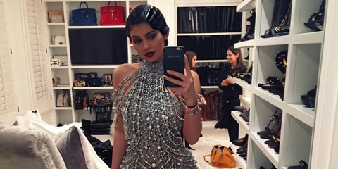 Kylie Jenner wearing a metallic 20s dress