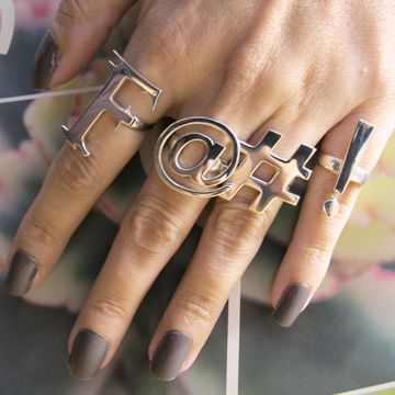 Finger, Nail, Metal, Thumb, Silver, Cosmetics, Musical instrument accessory, Wind instrument, Ring, Body jewelry, 