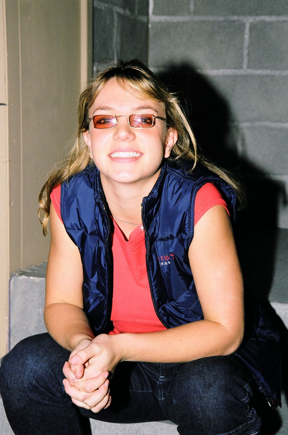 Britney Spears wearing orange tinted glasses frames