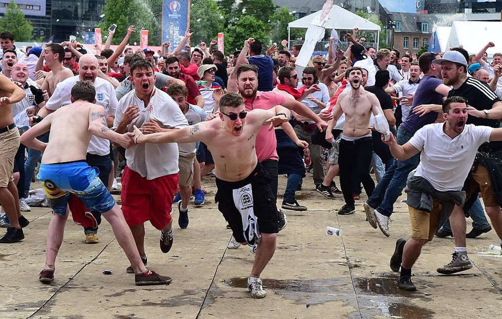 England fans have been accused of making a child drink beer for money