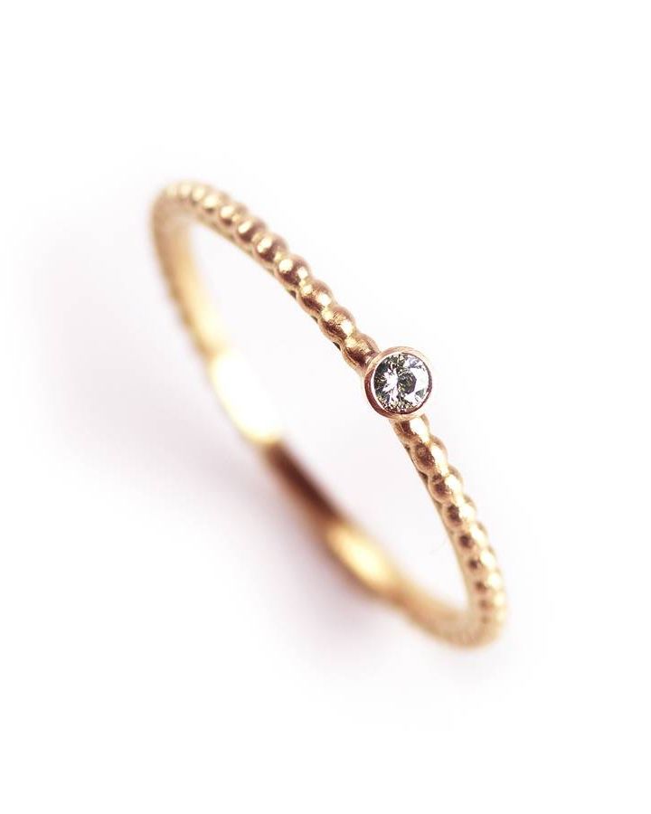 Jewellery, Ring, Body jewelry, Fashion accessory, Finger, Engagement ring, Yellow, Diamond, Wedding ring, Gemstone, 