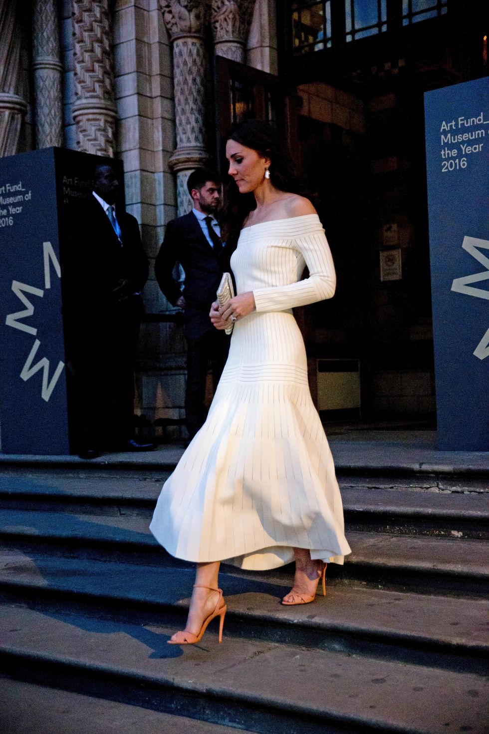 Kate Middleton wearing an off-the-shoulder white dress