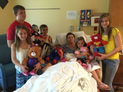 This brave woman took in her late best friend's six children following her death from cancer